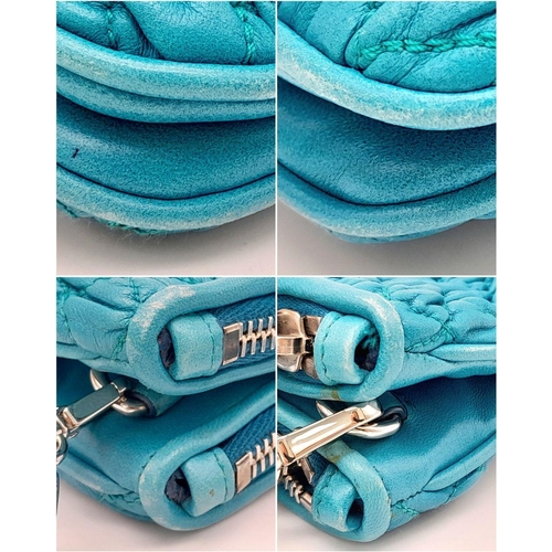 730 - A Miu Miu Turquoise Crystal Bag. Matelasse leather exterior with silver-toned hardware, detachable a... 