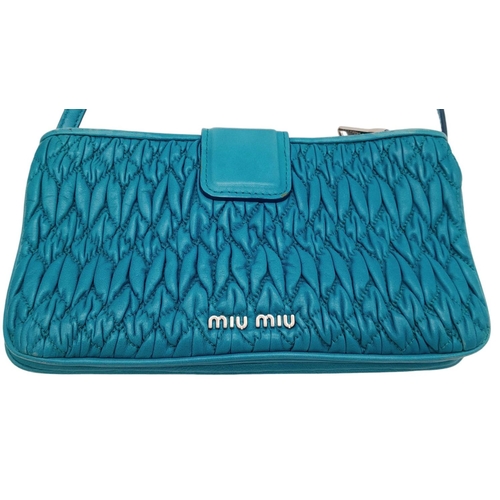 730 - A Miu Miu Turquoise Crystal Bag. Matelasse leather exterior with silver-toned hardware, detachable a... 