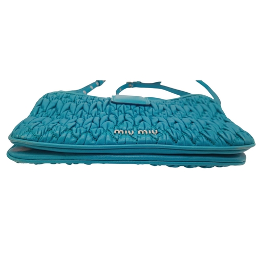 730 - A Miu Miu Turquoise Crystal Bag. Matelasse leather exterior with silver-toned hardware, detachable a... 