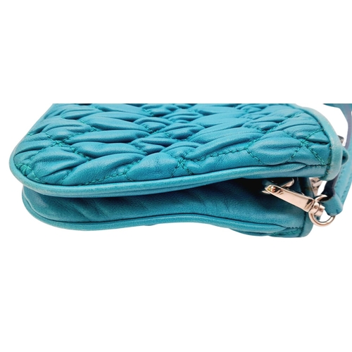 730 - A Miu Miu Turquoise Crystal Bag. Matelasse leather exterior with silver-toned hardware, detachable a... 