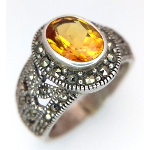 1512 - A STERLING SILVER MARQUISITE & ORANGE STONE SET RING. TOTAL WEIGHT APPROX. 7.7G. SIZE S. Ref: SC 410... 