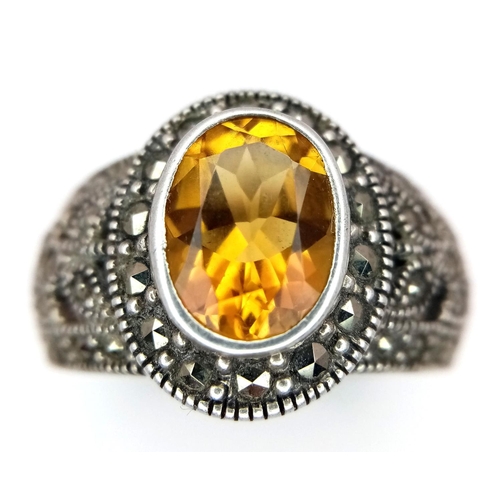 1512 - A STERLING SILVER MARQUISITE & ORANGE STONE SET RING. TOTAL WEIGHT APPROX. 7.7G. SIZE S. Ref: SC 410... 