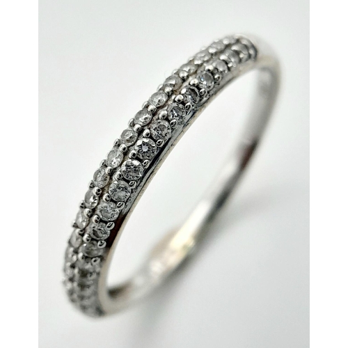 1442 - A 18K WHITE GOLD DIAMOND SET 2 ROW BAND RING 0.20CT 1.7G SIZE L. Ref: SC 4058