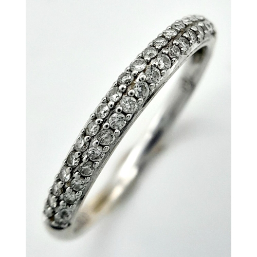 1442 - A 18K WHITE GOLD DIAMOND SET 2 ROW BAND RING 0.20CT 1.7G SIZE L. Ref: SC 4058