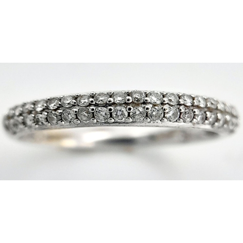 1442 - A 18K WHITE GOLD DIAMOND SET 2 ROW BAND RING 0.20CT 1.7G SIZE L. Ref: SC 4058