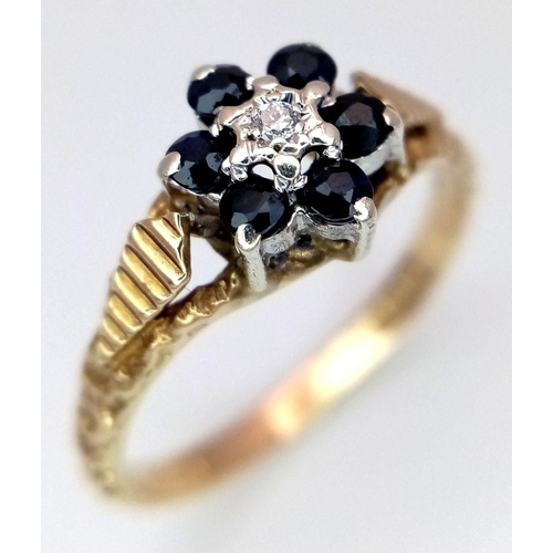 1505 - A 9K YELLOW GOLD DIAMOND & SAPPHIRE SET, IN THE FLORAL DESIGN RING 2.1G SIZE N. Ref: SC 4004