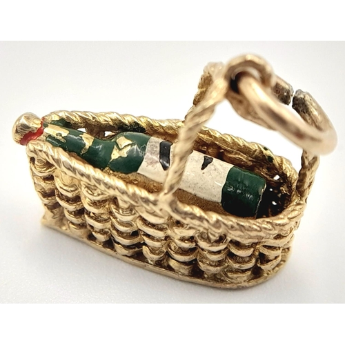 1484 - A 9K YELLOW GOLD WINE BASKET CHARM WITH BOTTLE OF WINE INSIDE 3.2G , APPROX 20MM X 18MM. Ref: SC 404... 