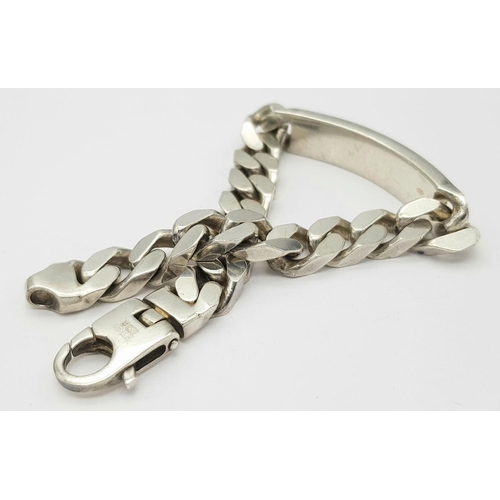 1218 - A STERLING SILVER HEAVY ID BRACELET. 65.3G. SC3096.