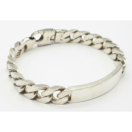 1218 - A STERLING SILVER HEAVY ID BRACELET. 65.3G. SC3096.