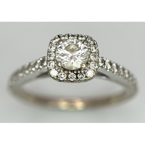 1183 - A Vera Wang 18K White Gold Diamond Halo Ring with Stone Set Shoulders, 0.71ct diamond weight, 4.3g t... 