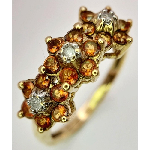 1516 - A 9K Yellow Gold Diamond and Orange Stone Set Ring, in the Floral Design ; 0.06ct diamond, 2.1g tota... 