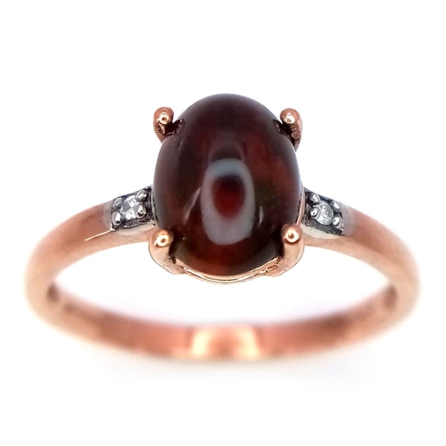 1494 - A 9K Yellow Gold Diamond and Garnet Ring, 0.01ct diamond weight, 1.4ct garnet weight, 1.5g total wei... 