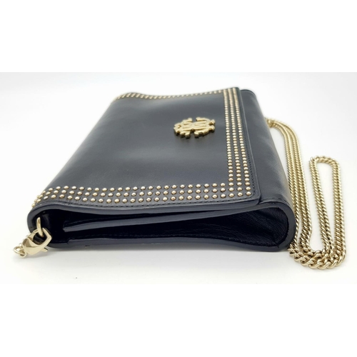 1153 - A Roberto Cavalli Small Black Leather Crossbody Bag. Exterior stud and monogram decoration. Gold ton... 