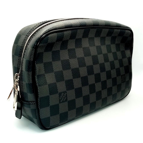 633 - A Louis Vuitton Damier Graphite Toiletry Pouch. Coated canvas exterior with silver-toned hardware an... 