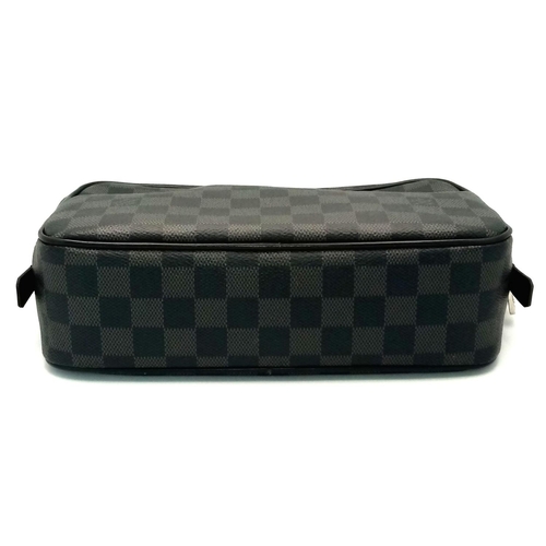 633 - A Louis Vuitton Damier Graphite Toiletry Pouch. Coated canvas exterior with silver-toned hardware an... 