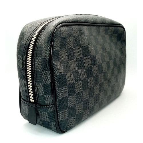 633 - A Louis Vuitton Damier Graphite Toiletry Pouch. Coated canvas exterior with silver-toned hardware an... 