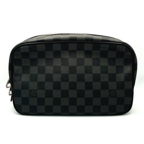 633 - A Louis Vuitton Damier Graphite Toiletry Pouch. Coated canvas exterior with silver-toned hardware an... 