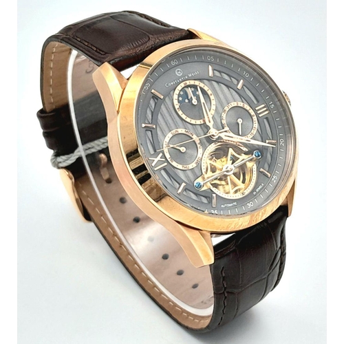 1308 - An Gold Tone Constantin Weisz Men’s Automatic, Open Heart/ Skeleton Back, Moonphase Calendar Watch. ... 