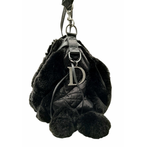 1005 - A Christian Dior Faux Fur Shoulder Bag with Hanging Tassels. Silver tone hardware. Red textile inter... 