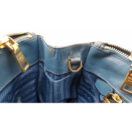 717 - A Prada Blue Saffiano Leather Double Handle Bag. Two-tone blue saffiano leather exterior with gold-t... 