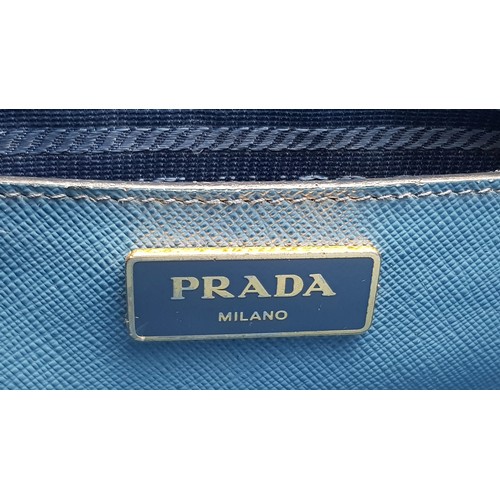 717 - A Prada Blue Saffiano Leather Double Handle Bag. Two-tone blue saffiano leather exterior with gold-t... 