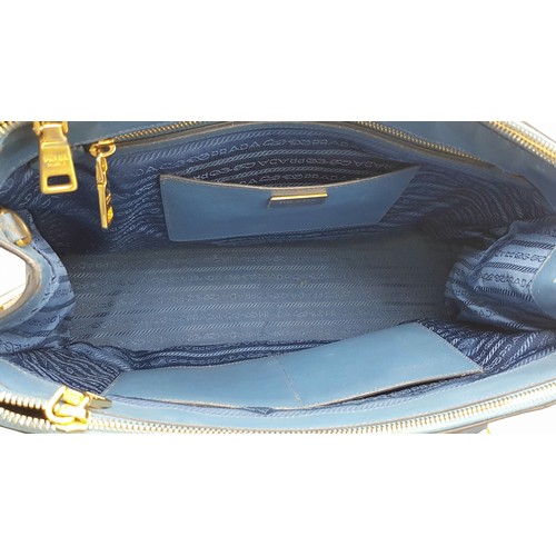 717 - A Prada Blue Saffiano Leather Double Handle Bag. Two-tone blue saffiano leather exterior with gold-t... 