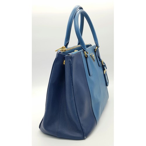 717 - A Prada Blue Saffiano Leather Double Handle Bag. Two-tone blue saffiano leather exterior with gold-t... 