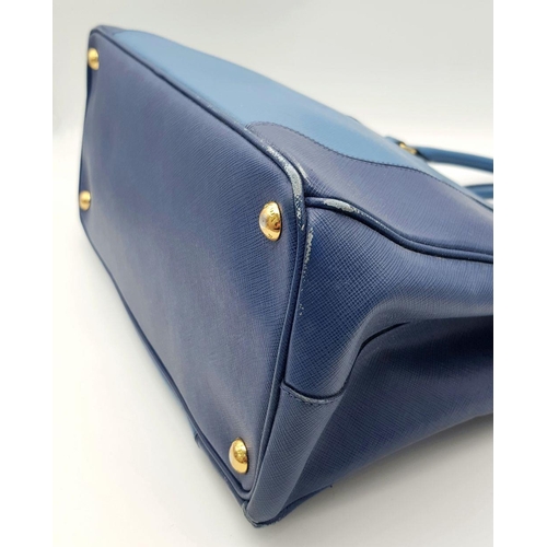 717 - A Prada Blue Saffiano Leather Double Handle Bag. Two-tone blue saffiano leather exterior with gold-t... 