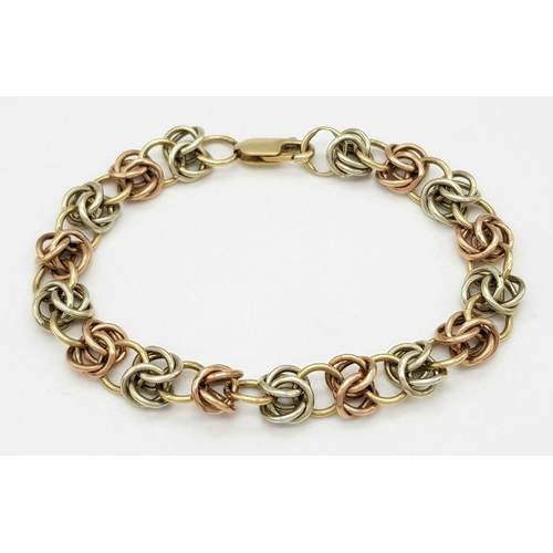 1010 - A 9K Bi-Colour Gold Multi-Link Bracelet. 15cm. 12.3g