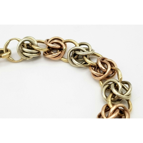 1010 - A 9K Bi-Colour Gold Multi-Link Bracelet. 15cm. 12.3g