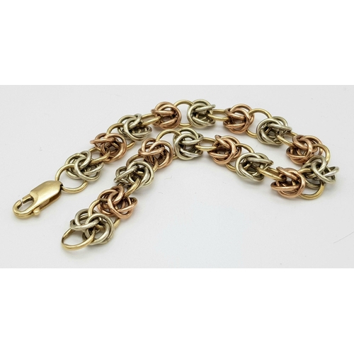 1010 - A 9K Bi-Colour Gold Multi-Link Bracelet. 15cm. 12.3g