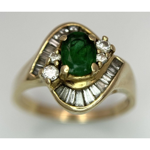 102 - A 14K YELLOW GOLD DIAMOND AND EMERALD FANCY RING. 0.40CT. SLIGHT DAMAGE ON THE EMERALD - NOT VISIBLE... 