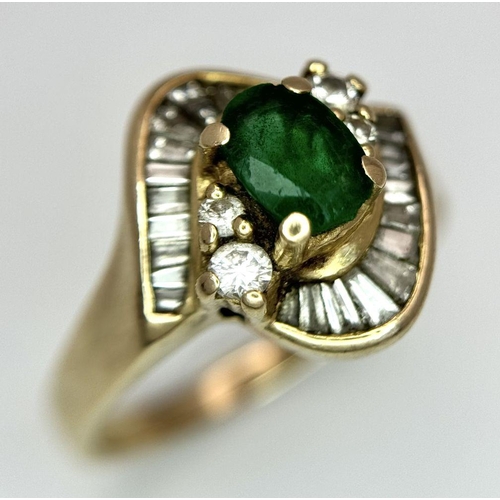 102 - A 14K YELLOW GOLD DIAMOND AND EMERALD FANCY RING. 0.40CT. SLIGHT DAMAGE ON THE EMERALD - NOT VISIBLE... 