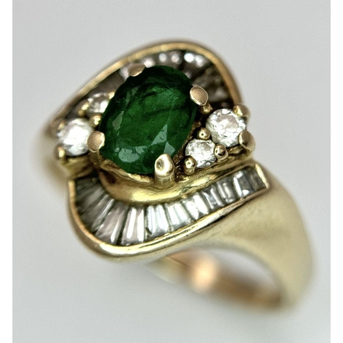 102 - A 14K YELLOW GOLD DIAMOND AND EMERALD FANCY RING. 0.40CT. SLIGHT DAMAGE ON THE EMERALD - NOT VISIBLE... 