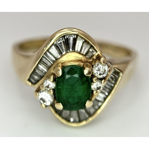 102 - A 14K YELLOW GOLD DIAMOND AND EMERALD FANCY RING. 0.40CT. SLIGHT DAMAGE ON THE EMERALD - NOT VISIBLE... 