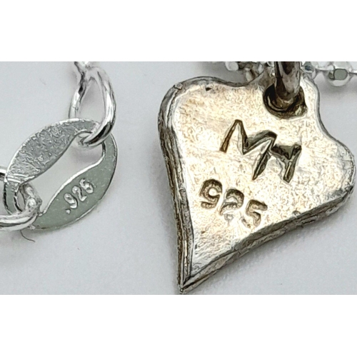 1085 - A STERLING SILVER MOON & HEART PENDANT ON A CHAIN. 40CM. 3.8G. SC5079