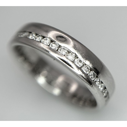 109 - A STYLISH PLATINUM DIAMOND FULL ETERNITY RING. 8.6G. SIZE Q. SC5043.