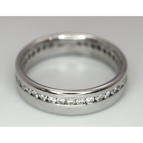 109 - A STYLISH PLATINUM DIAMOND FULL ETERNITY RING. 8.6G. SIZE Q. SC5043.