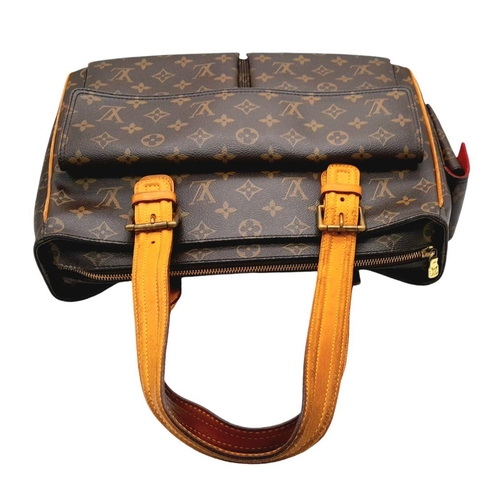 129 - A Louis Vuitton Viva Cite Large Shoulder Bag. Coated LV canvas exterior with two large pockets. Brow... 