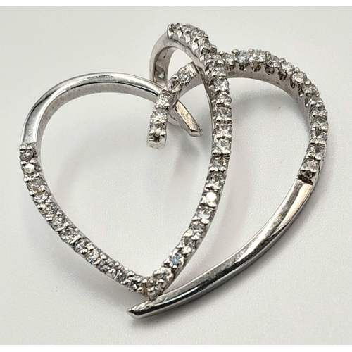 130 - AN 18K WHITE GOLD AND DIAMOND SET, OPEN SPIRAL HEART PENDANT. 0.50CT. 5.4G. SC5063