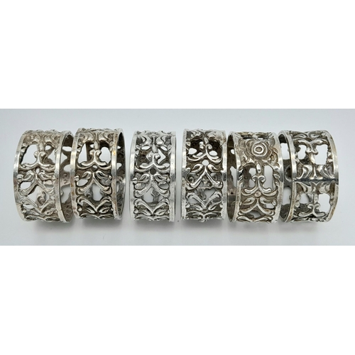 1361 - Six Identical Silver Rings. All size S. Pierced decoration. 21g. 
In a case.