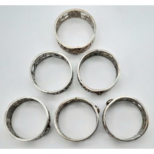 1361 - Six Identical Silver Rings. All size S. Pierced decoration. 21g. 
In a case.