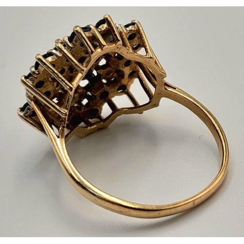 193 - AN ARTISTICALLY SET, 9K YELLOW GOLD DIAMOND AND SAPPHIRE LARGE CLUSTER RING. 5G. SIZE U. SC5050