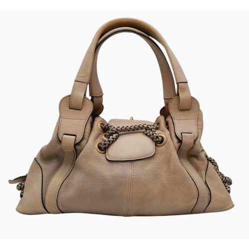 206 - A Mulberry Beige Leather Handbag. Leather exterior with brass-toned hardware and drawstring closure.... 