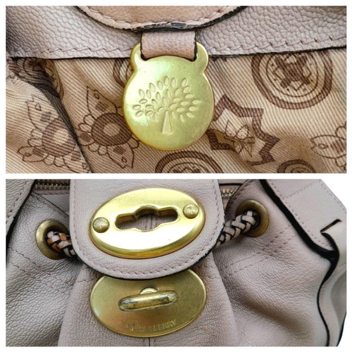 206 - A Mulberry Beige Leather Handbag. Leather exterior with brass-toned hardware and drawstring closure.... 