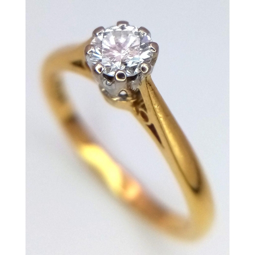 214 - AN 18K YELLOW GOLD DIAMOND SET SOLITAIRE RING. 0.15CT. 2.3G. SIZE K. 8867