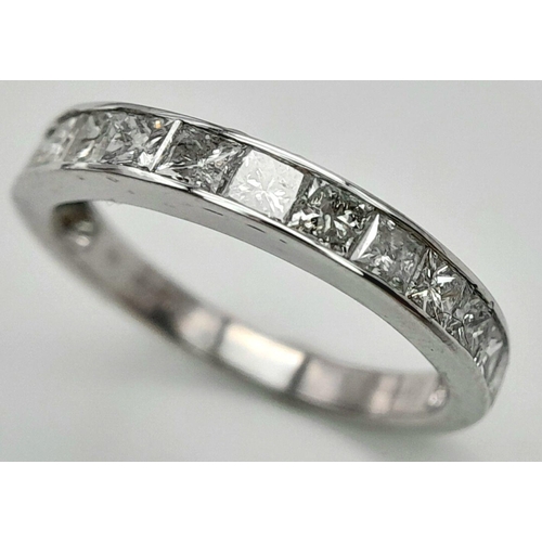 272 - A 9K WHITE GOLD DIAMOND SET HALF ETERNITY RING. PRINCESS CUTS. APPROX 1CTW. 2.4G. SIZE L. SC5046