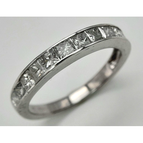 272 - A 9K WHITE GOLD DIAMOND SET HALF ETERNITY RING. PRINCESS CUTS. APPROX 1CTW. 2.4G. SIZE L. SC5046