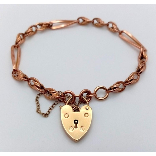 29 - A 9K rose Gold Twisted Bar and Knot Link Bracelet with a yellow gold Heart padlock Clasp. 18cm. 11.0... 