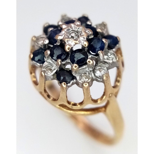 307 - A 9K YELLOW GOLD DIAMOND AND SAPPHIRE FLORAL FORM RING. RAISED SETTING. 2.6G. SIZE L. SC5067